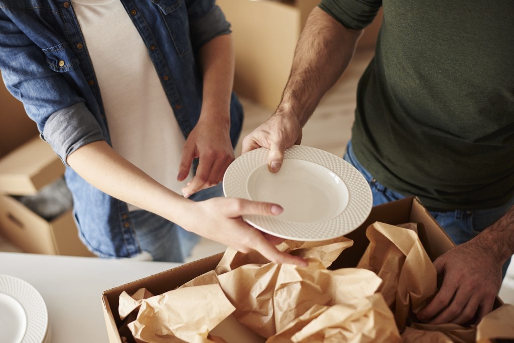 Packing dinnerware to the boxes