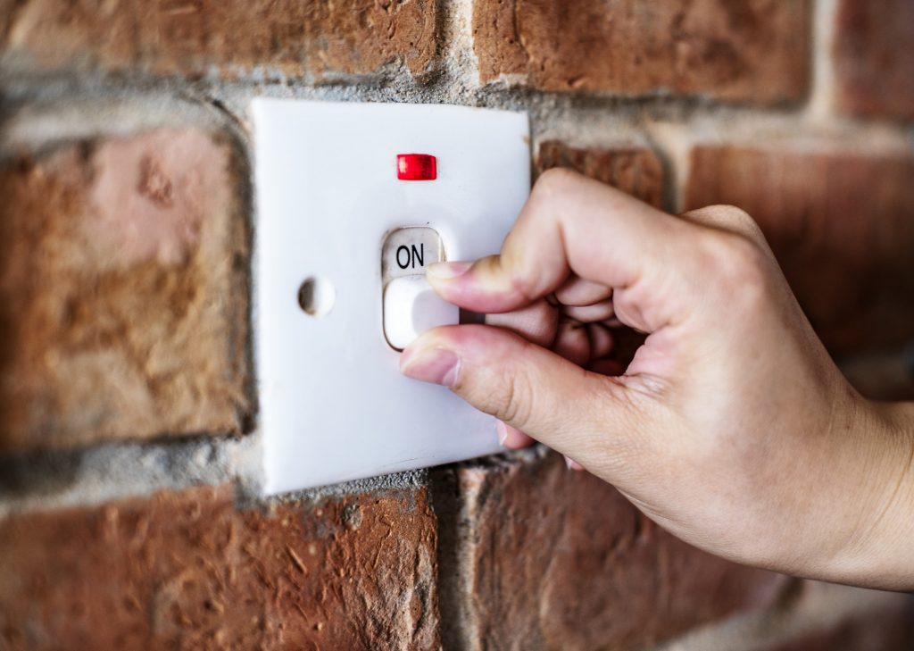 Closeup of switch on brick wall